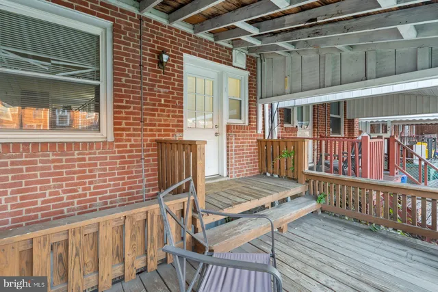 a view of a backyard with sitting area