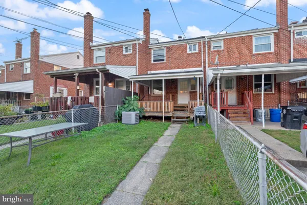 a front view of a building with garden
