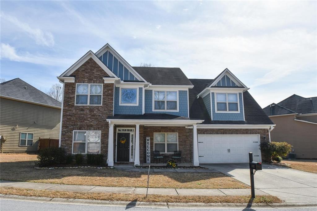 9592 Rushmore Circle Braselton, GA 30517 - Photo 1 of 1 a front view of a house with a yard