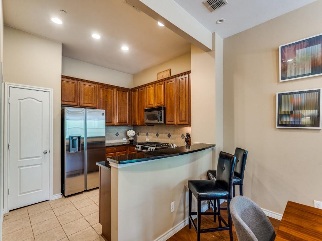 15711 Spectrum Drive, Unit 80 Addison, TX 75001 - Photo 12 of 26 a kitchen with a sink cabinets and appliances