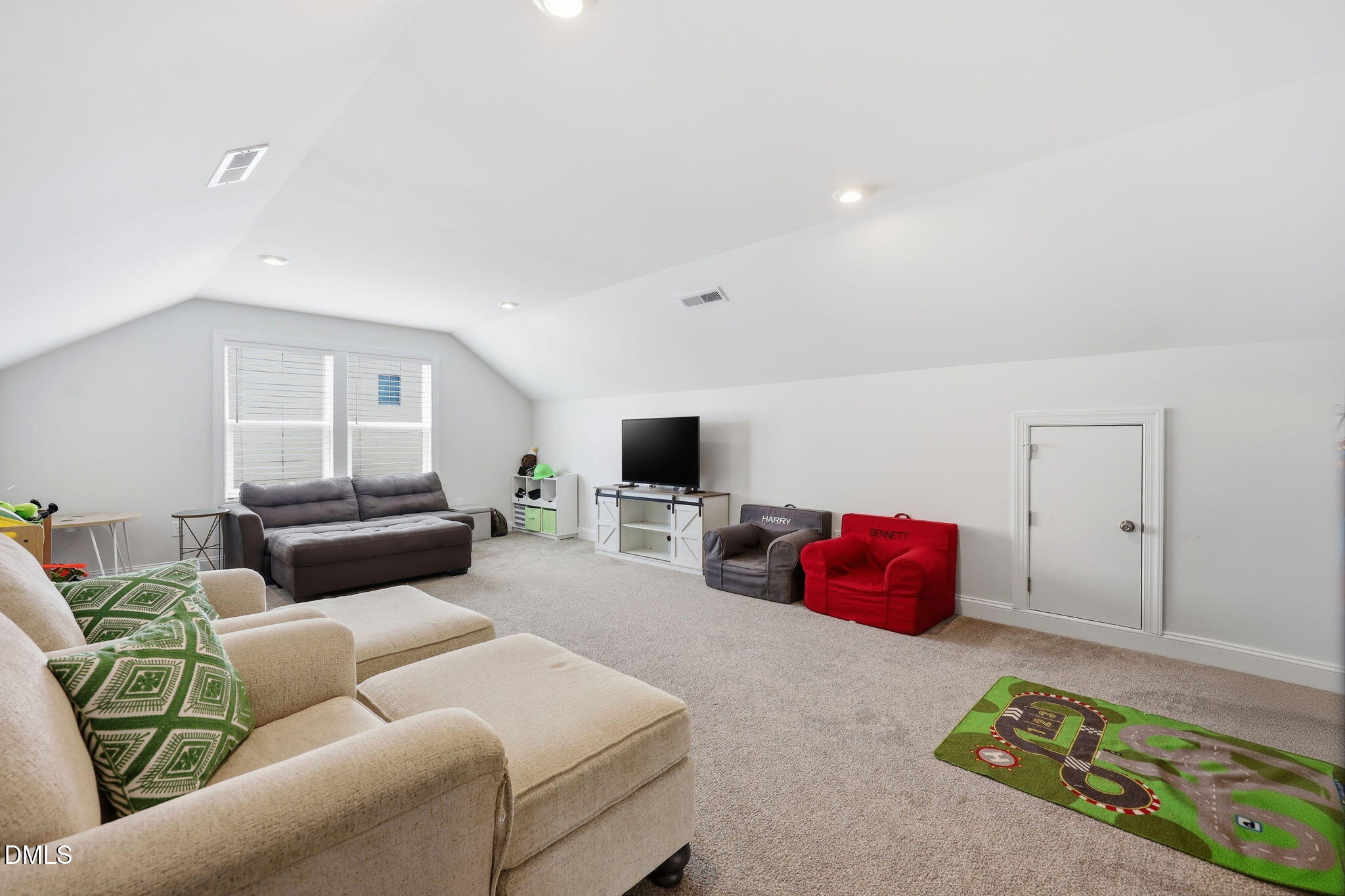104 Kavanaugh Road Wake Forest, NC 27587 - Photo 24 of 36 a living room with furniture and a flat screen tv