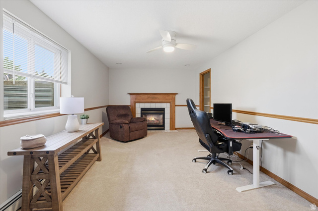 45 West 100 South Mendon, UT 84325 - Photo 26 of 64 Office with light colored carpet, a fireplace, a baseboard radiator, and ceiling fan