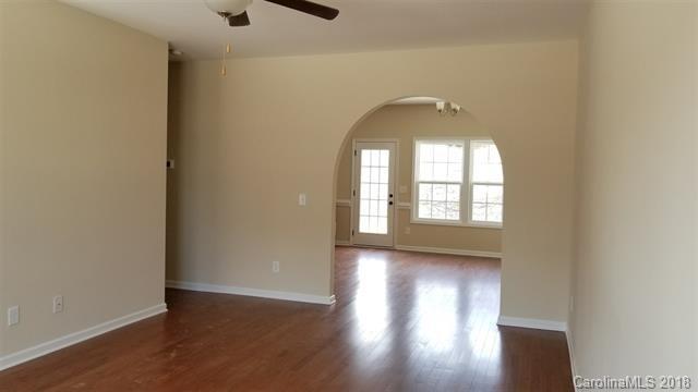 428 Windsor Gate Drive Fort Mill, SC 29708 - Photo 3 of 13 an empty room with wooden floor and windows