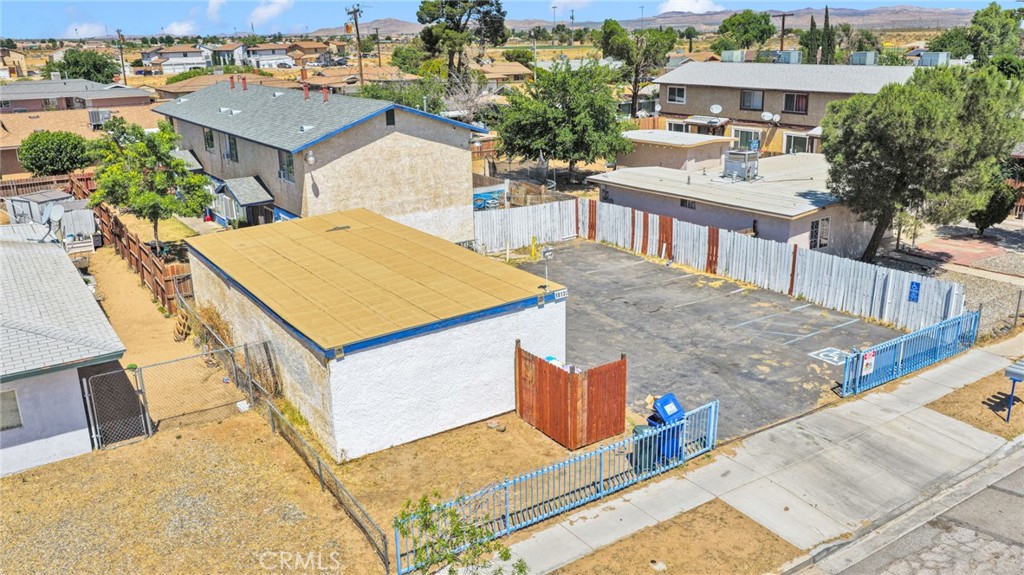 18130 Casaba Road Adelanto, CA 92301 - Photo 6 of 13 a view of a house with roof deck and sitting area