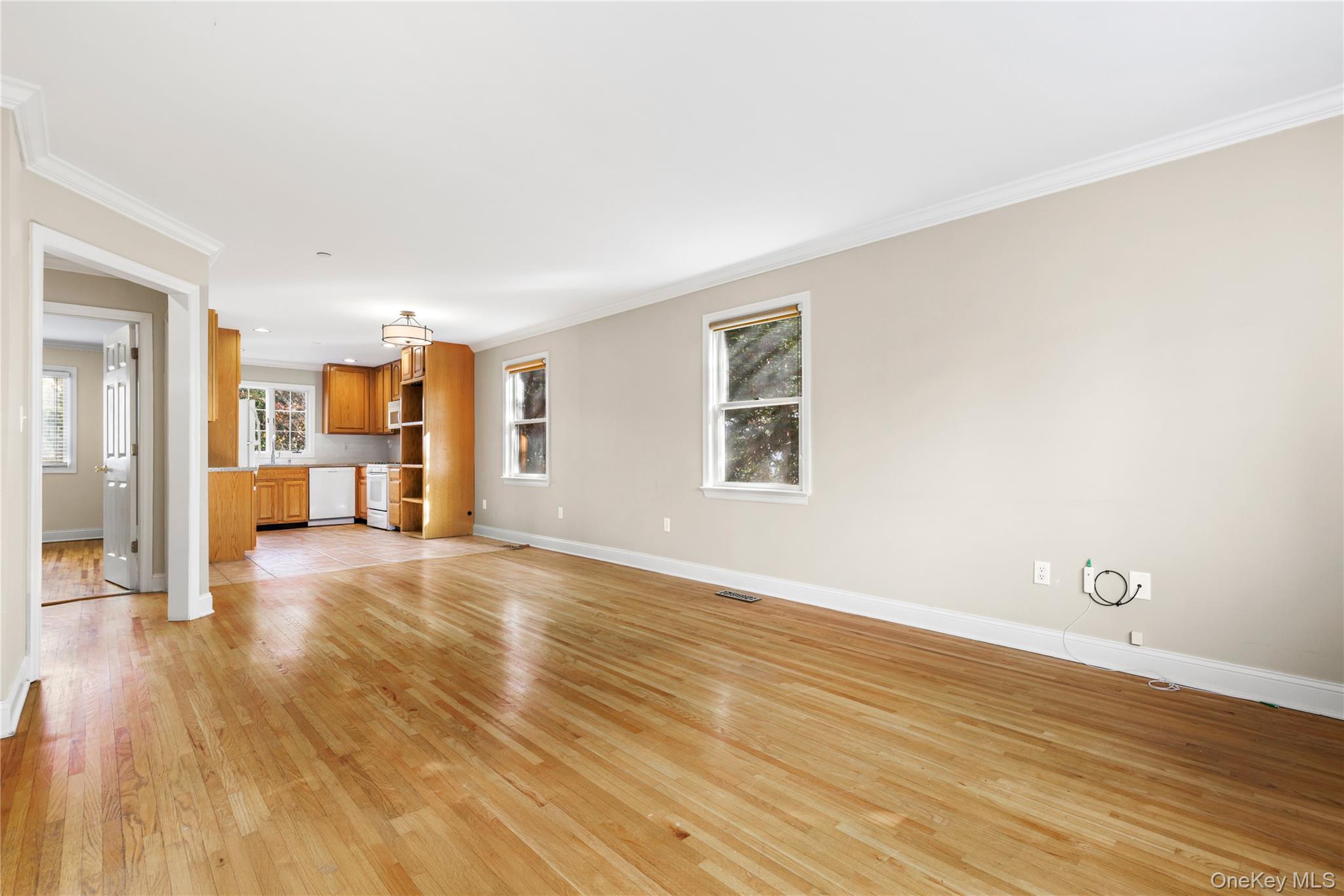 2 Goldwin Street, Unit 1 Rye, NY 10580 - Photo 3 of 18 an empty room with wooden floor and windows