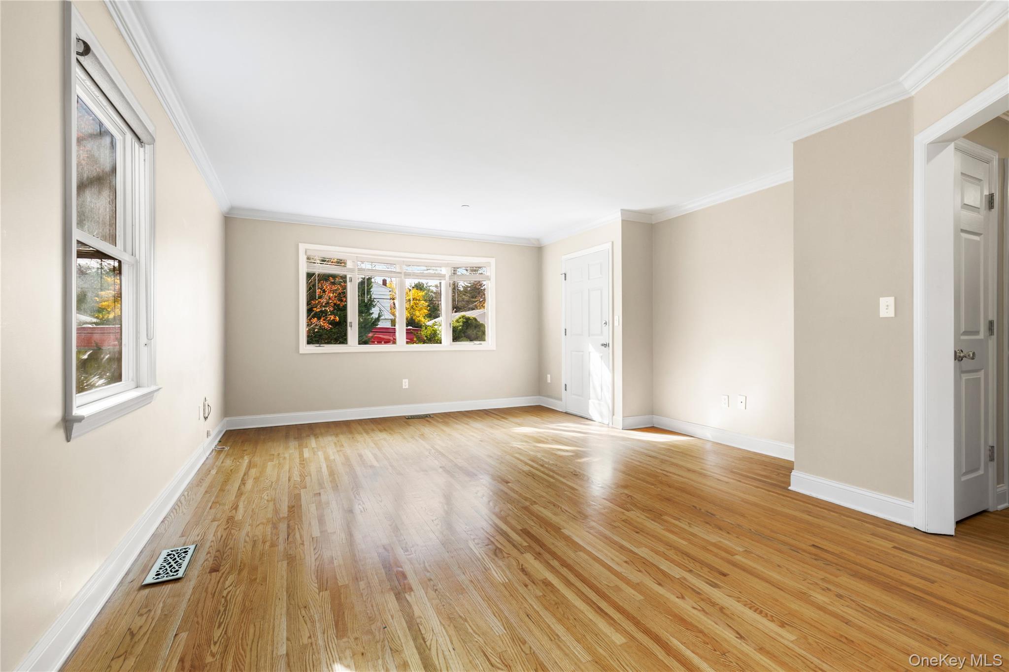 2 Goldwin Street, Unit 1 Rye, NY 10580 - Photo 4 of 18 a view of an empty room with wooden floor and a window