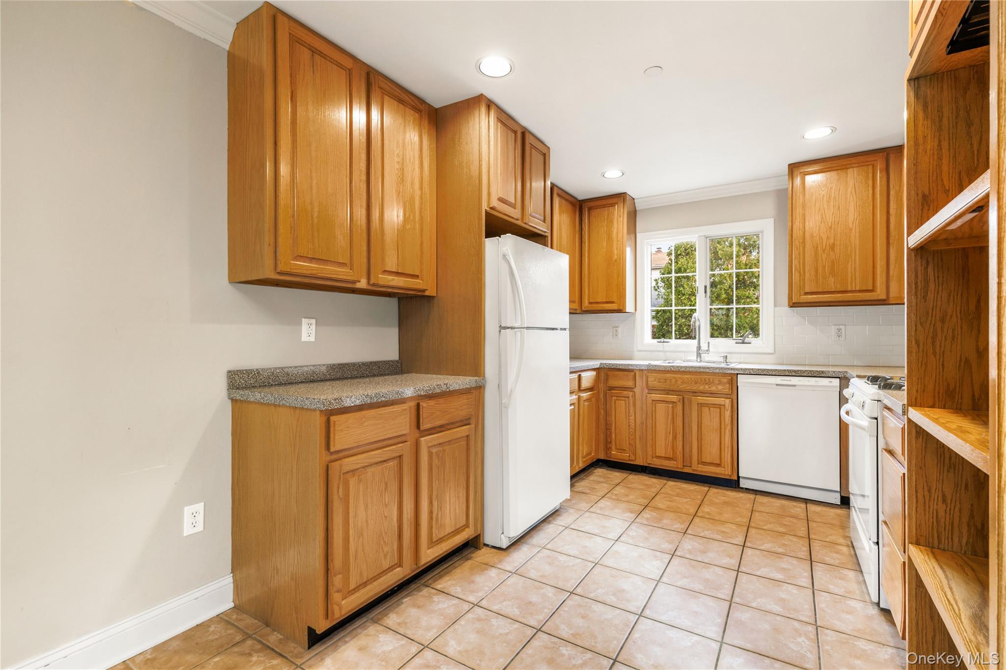 2 Goldwin Street, Unit 1 Rye, NY 10580 - Photo 5 of 18 a kitchen with a refrigerator sink and cabinets