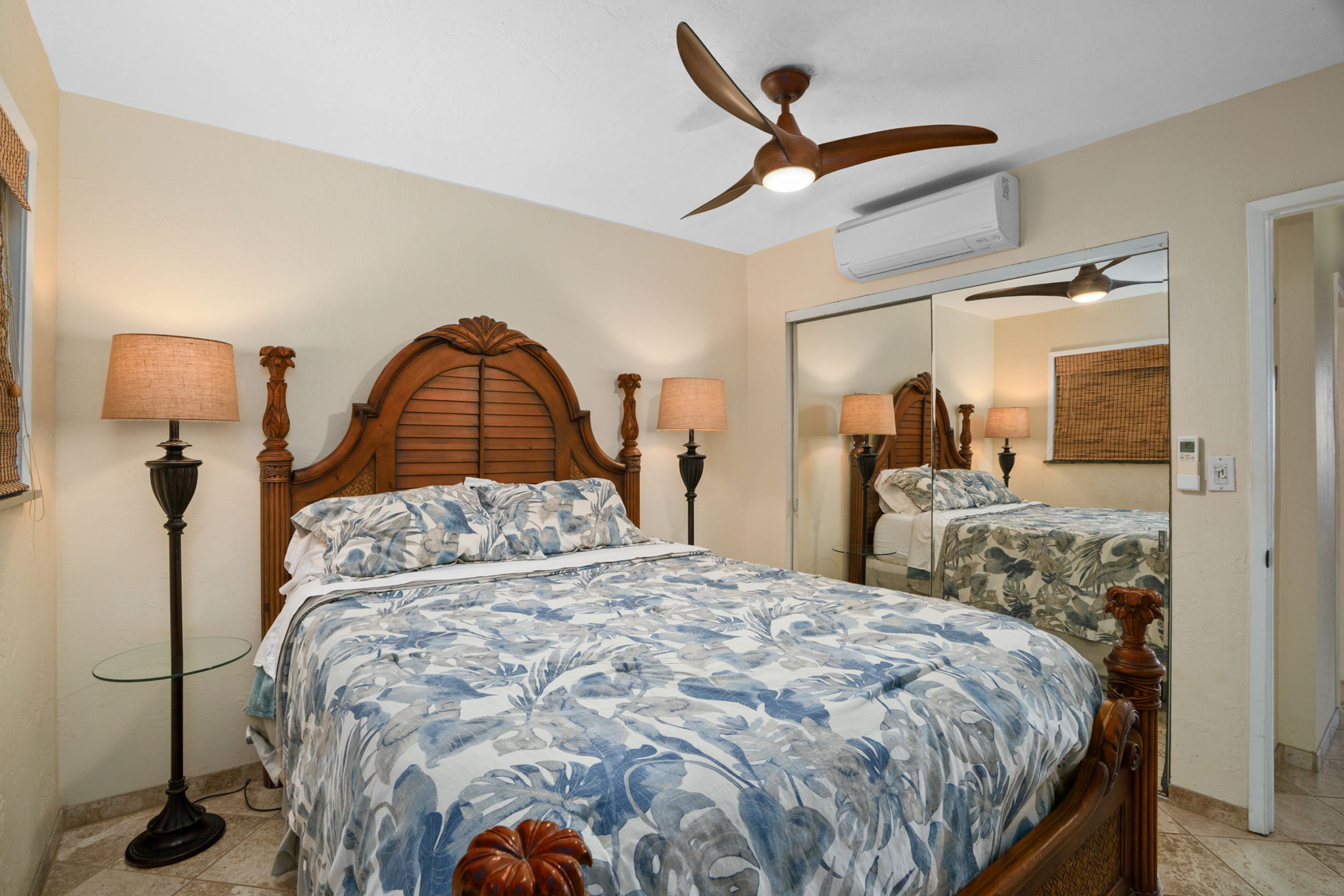 5050 Lawai Road, Unit 311 Koloa, HI 96756 - Photo 13 of 21 a bedroom with a bed and a mirror