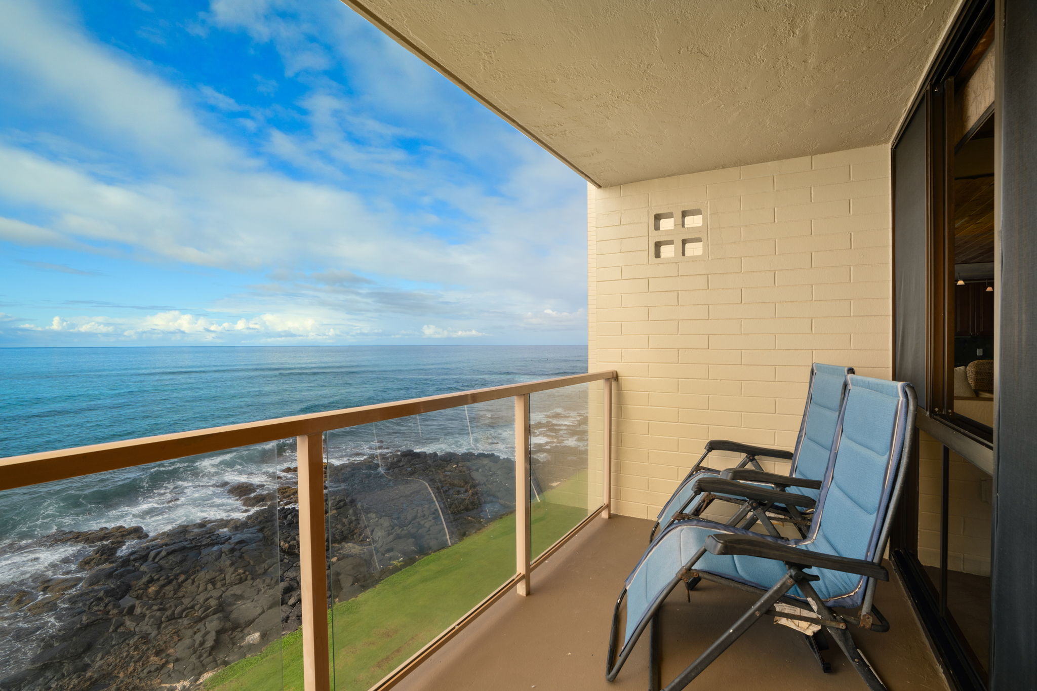 5050 Lawai Road, Unit 311 Koloa, HI 96756 - Photo 16 of 21 a view of a balcony with chair and table