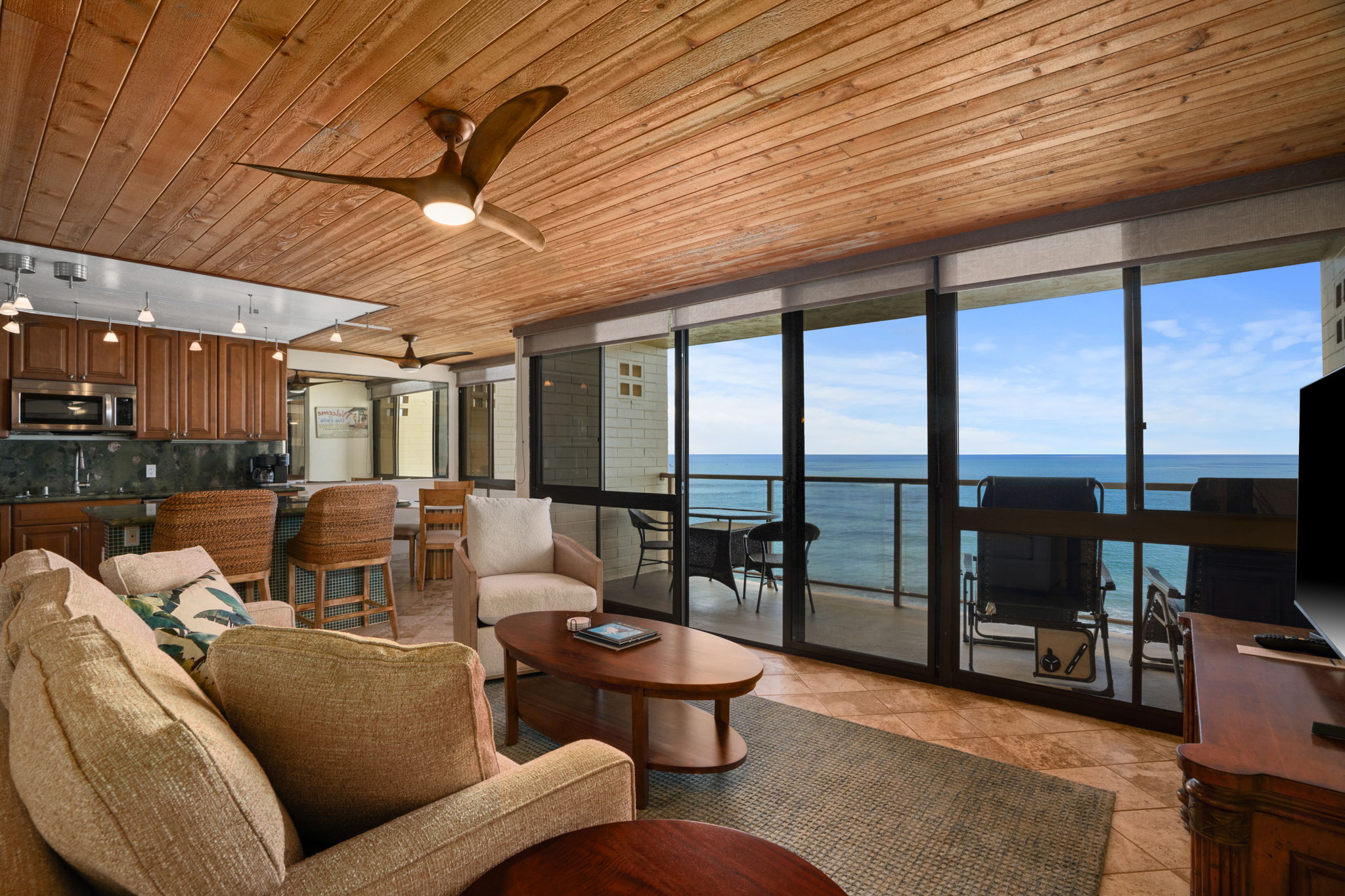 5050 Lawai Road, Unit 311 Koloa, HI 96756 - Photo 3 of 21 a living room with furniture and a floor to ceiling window