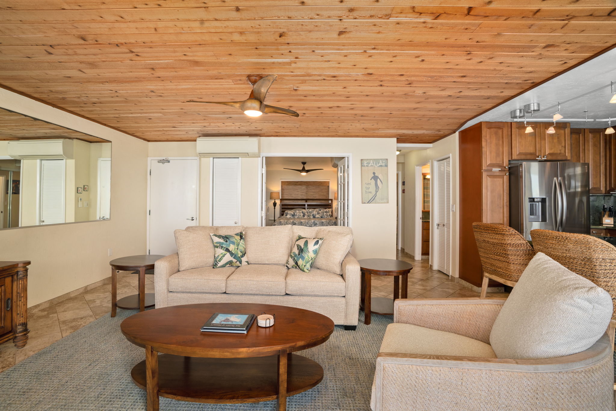 5050 Lawai Road, Unit 311 Koloa, HI 96756 - Photo 8 of 21 a living room with furniture and a large window