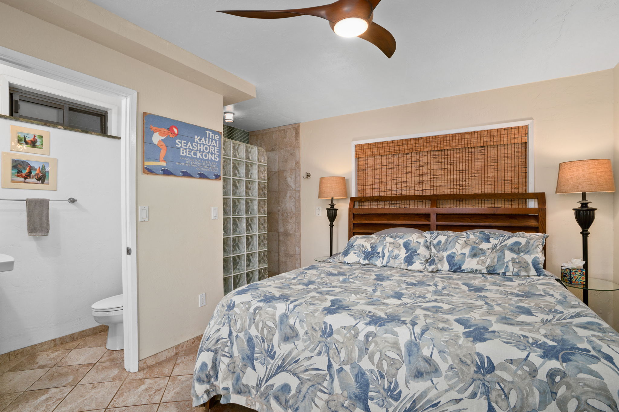 5050 Lawai Road, Unit 311 Koloa, HI 96756 - Photo 10 of 21 a bedroom with a bed and a painting on the wall