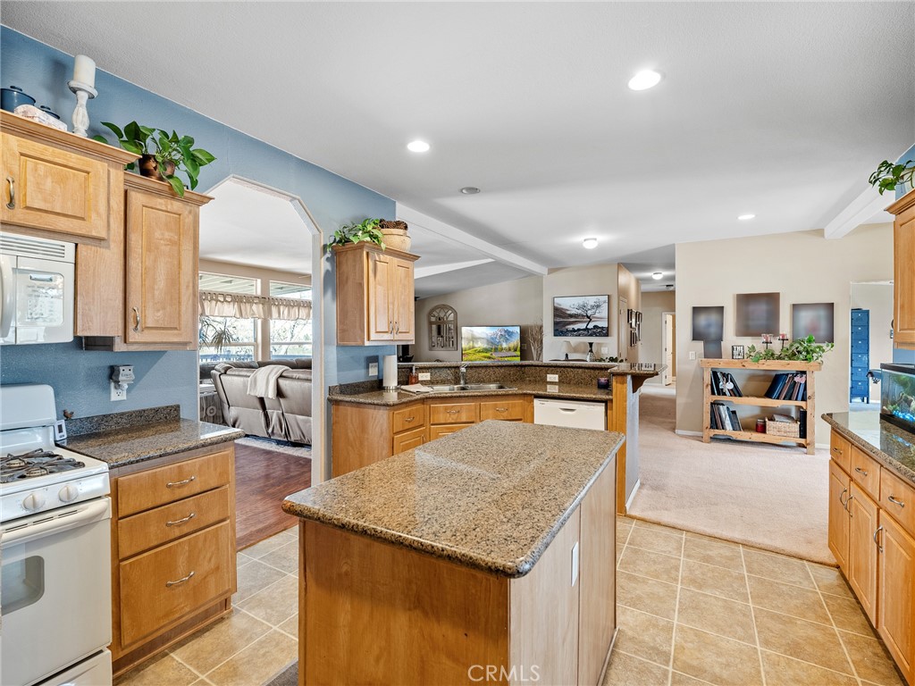 2826 Marco Road Phelan, CA 92371 - Photo 11 of 33 a large kitchen with cabinets table and chairs