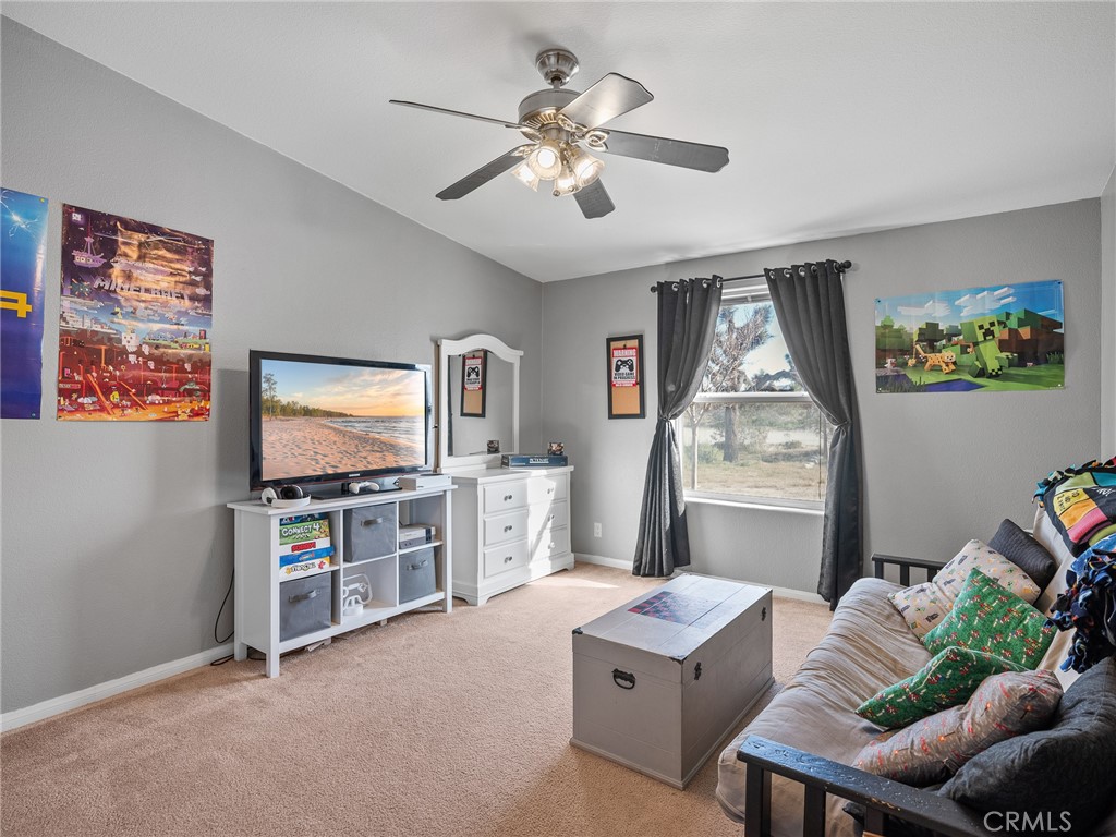 2826 Marco Road Phelan, CA 92371 - Photo 15 of 33 a living room with furniture and a flat screen tv