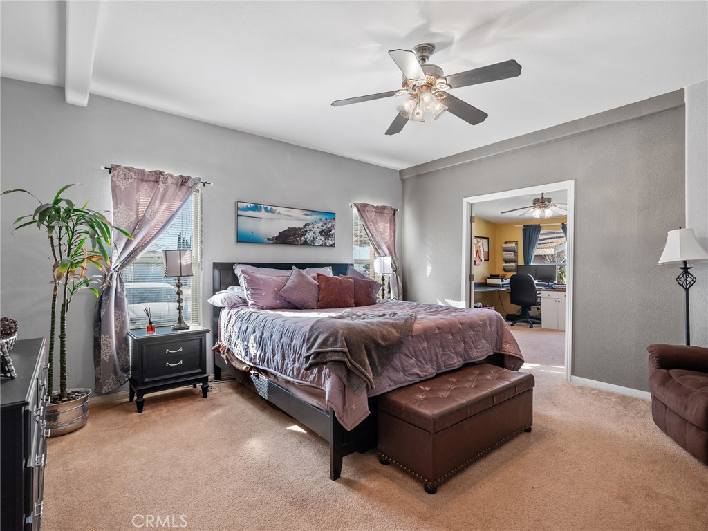 2826 Marco Road Phelan, CA 92371 - Photo 23 of 33 a spacious bedroom with a bed couch and window