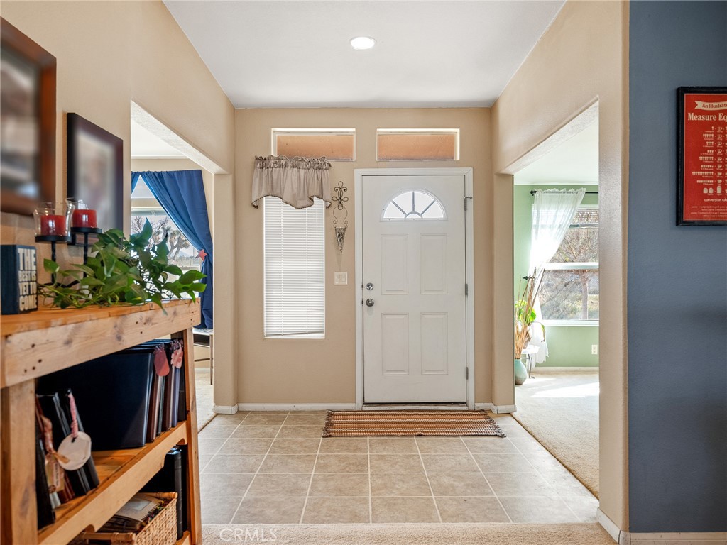 2826 Marco Road Phelan, CA 92371 - Photo 3 of 33 a view of entryway with kitchen and entryway