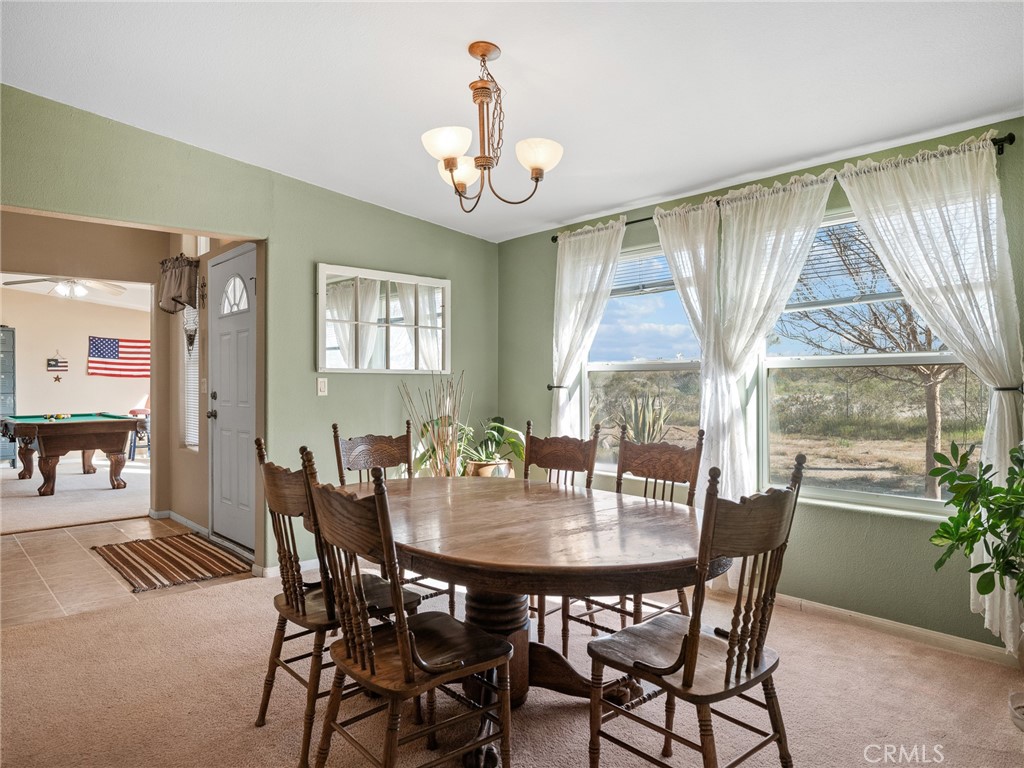 2826 Marco Road Phelan, CA 92371 - Photo 4 of 33 a view of a dining room with furniture and window