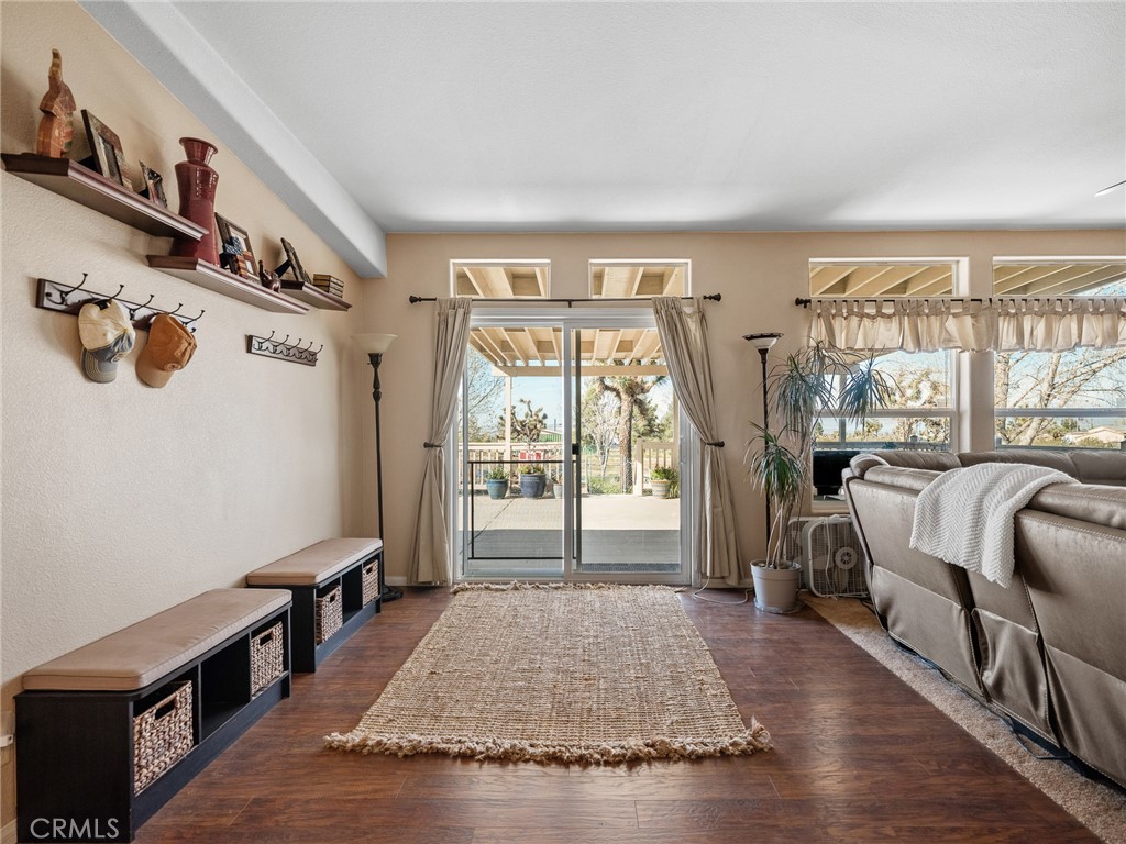 2826 Marco Road Phelan, CA 92371 - Photo 6 of 33 a living room with furniture lamp and a rug