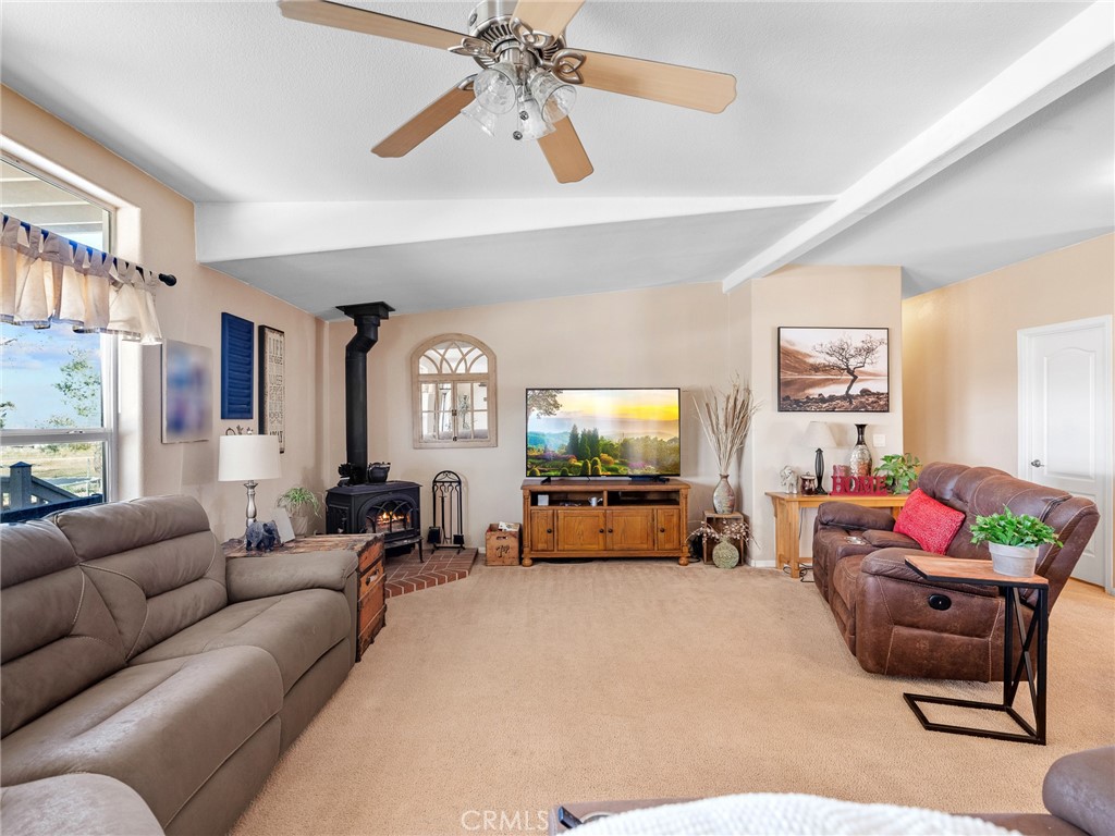 2826 Marco Road Phelan, CA 92371 - Photo 7 of 33 a living room with furniture and a flat screen tv