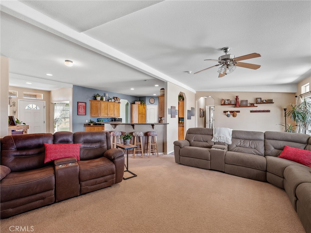 2826 Marco Road Phelan, CA 92371 - Photo 8 of 33 a living room with furniture and a ceiling fan