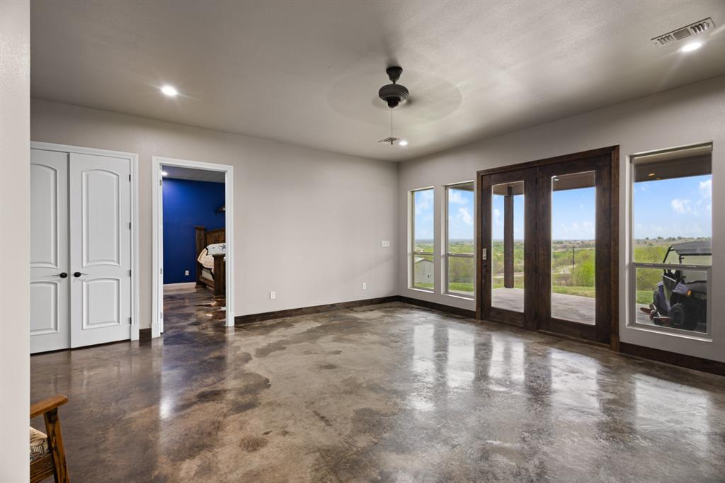 1395 Private Road 4011 Decatur, TX 76234 - Photo 19 of 34 wooden floor in an empty room with a window
