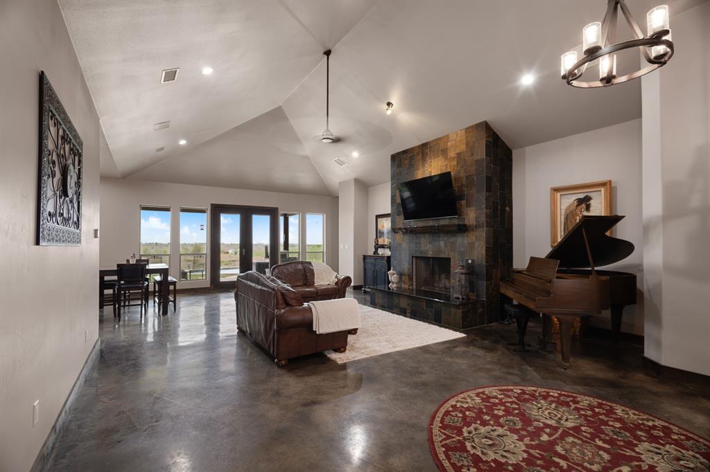1395 Private Road 4011 Decatur, TX 76234 - Photo 5 of 34 a living room with fireplace furniture and a flat screen tv