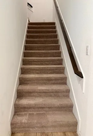 a view of a room that has a window in it