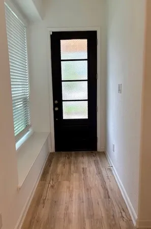 a kitchen with a refrigerator and a sink