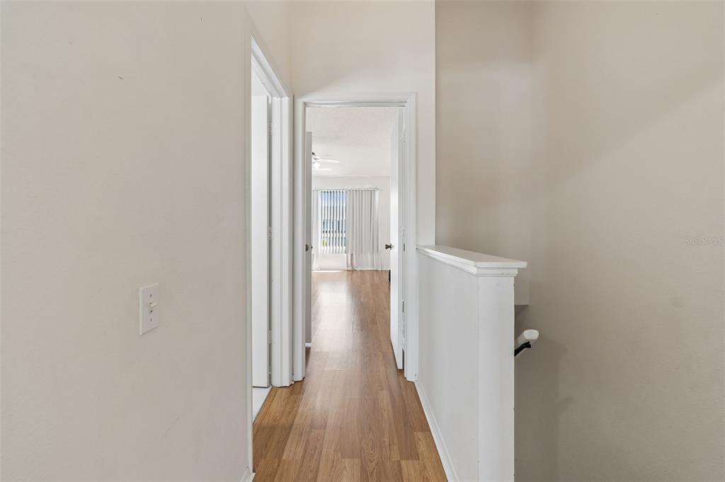 382 Countryside Key Boulevard Oldsmar, FL 34677 - Photo 31 of 58 a view of a hallway with wooden floor