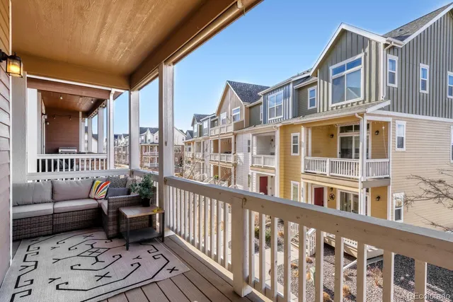 a view of a balcony with wooden floor