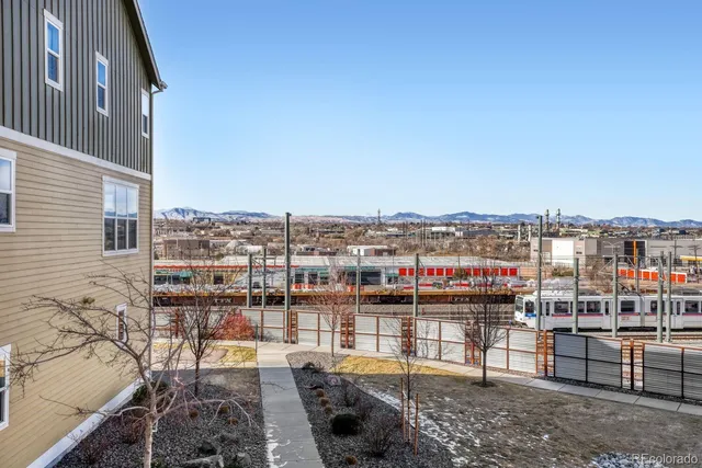 an aerial view of a residential apartment building with a yard