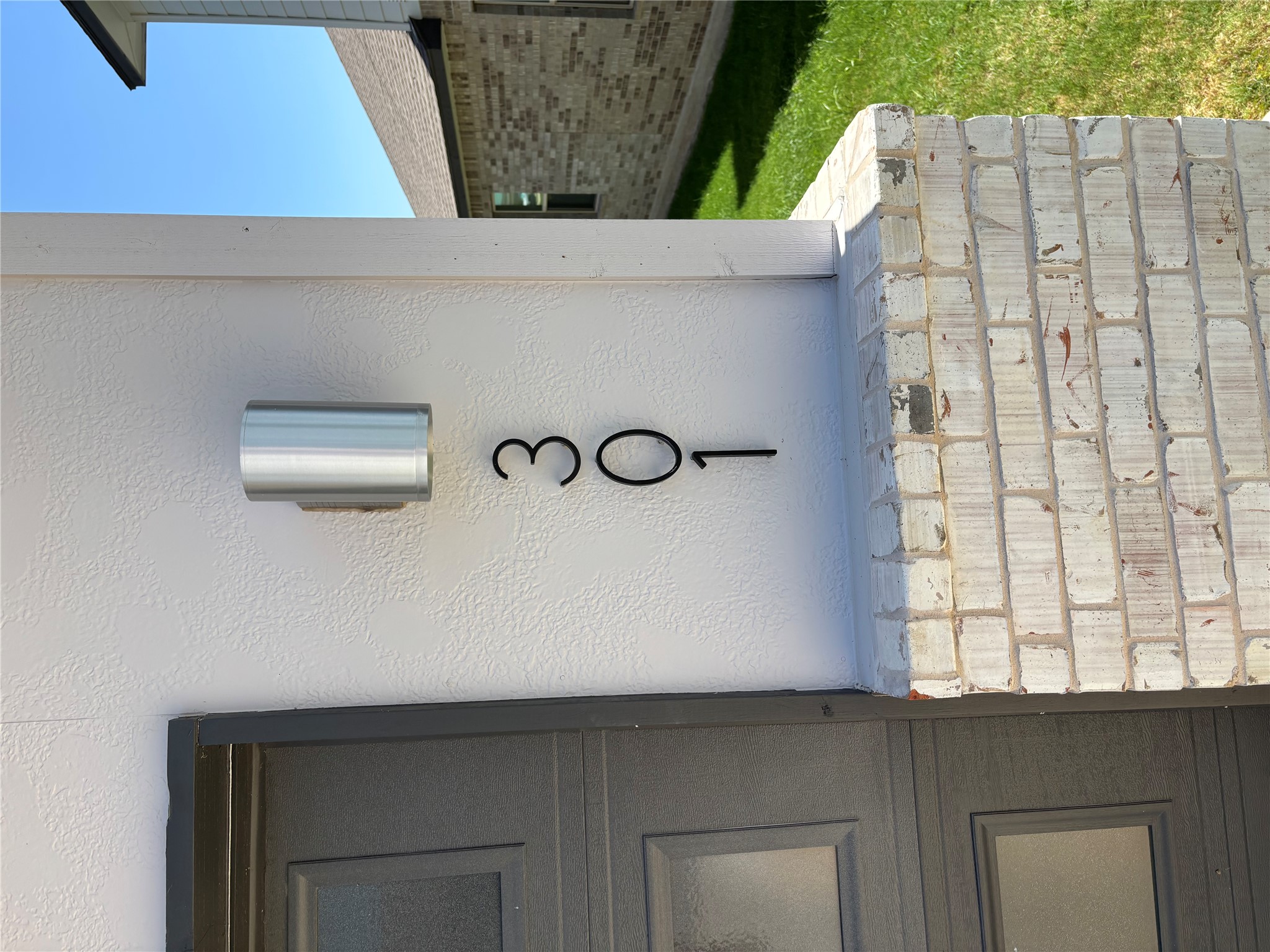 301 Tarkus Path Georgetown, TX 78633 - Photo 4 of 33 Modern house numbers complement the clean-lined exterior, offering distinct curb appeal.