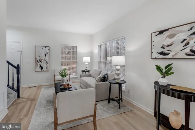 a living room with furniture a window and a fireplace