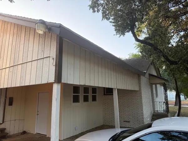 a back view of a house with a street
