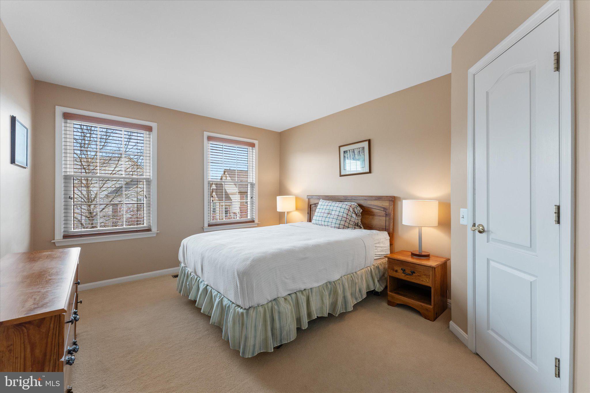 20900 Trinity Square Sterling, VA 20165 - Photo 15 of 46 a bedroom with a bed and window