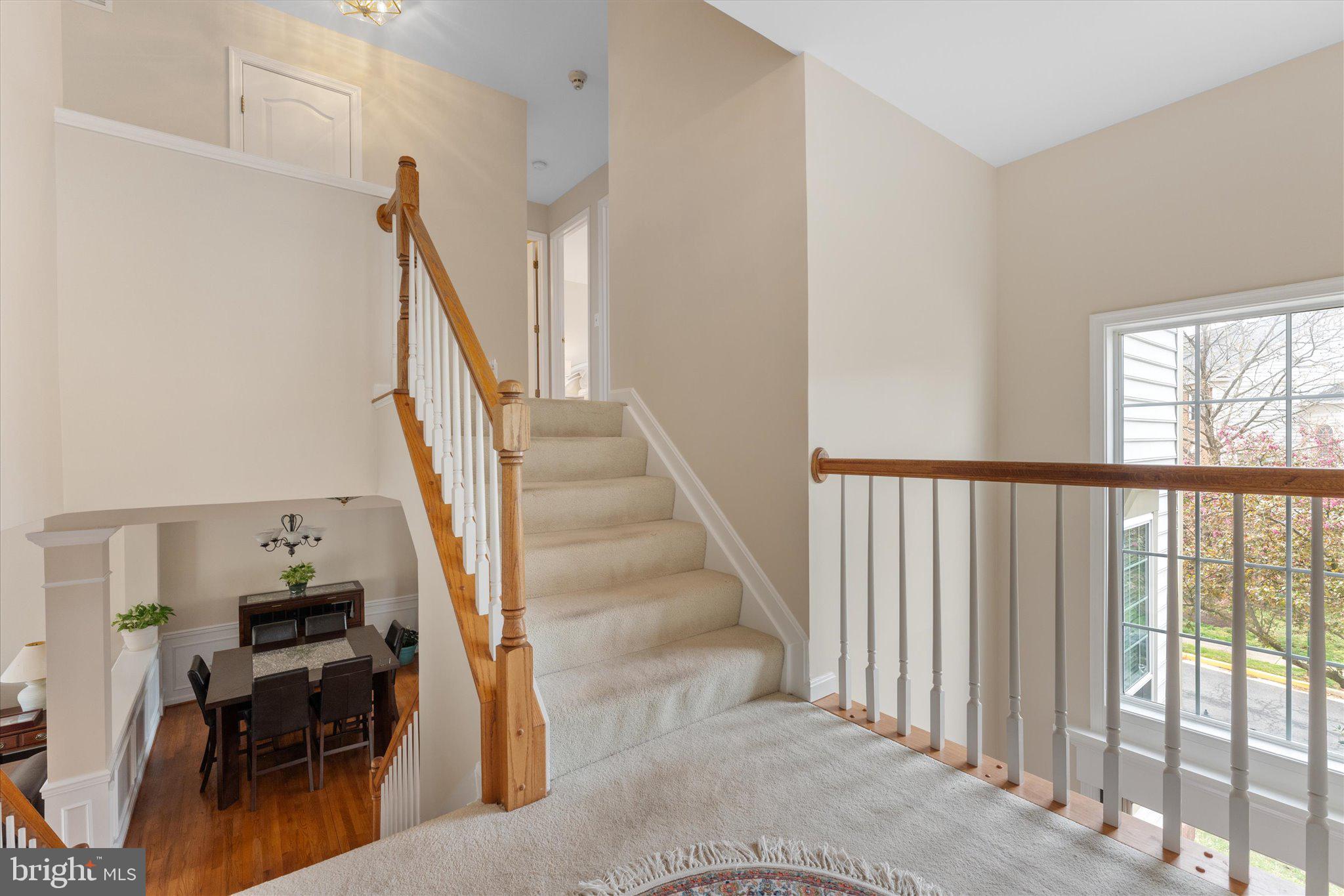 20900 Trinity Square Sterling, VA 20165 - Photo 17 of 46 a view of entryway and hall with wooden floor