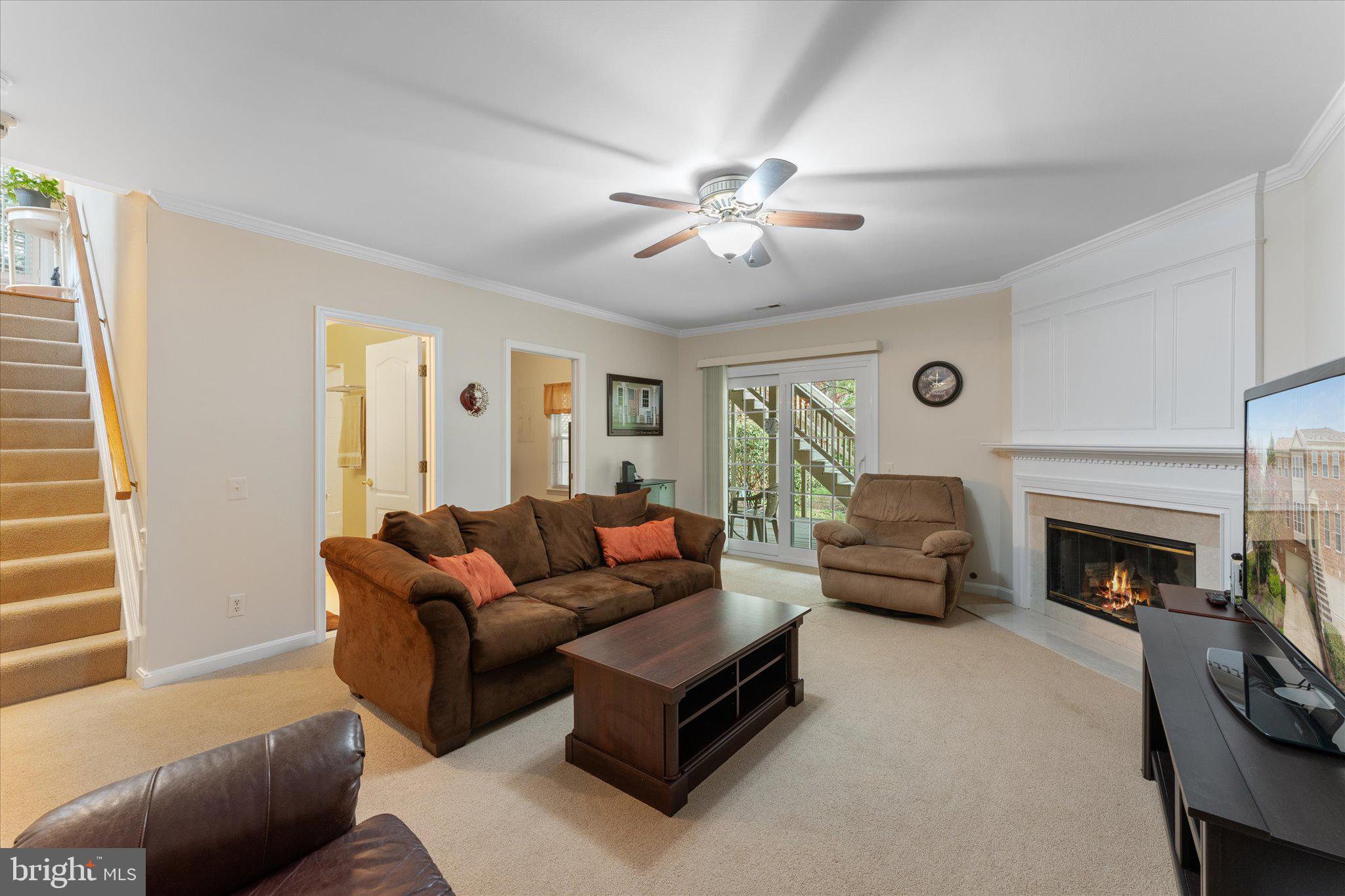 20900 Trinity Square Sterling, VA 20165 - Photo 19 of 46 a living room with furniture and a fireplace