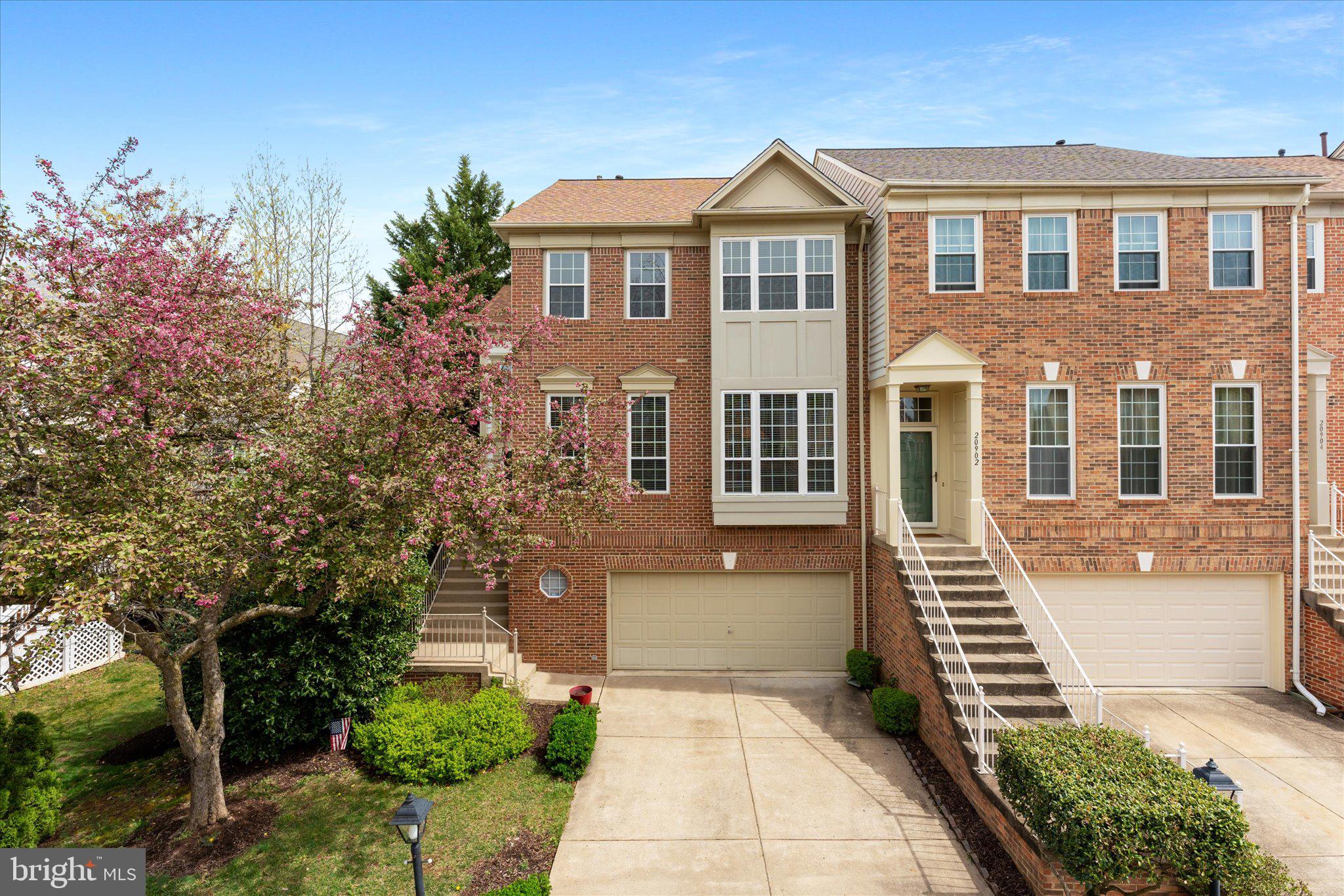 20900 Trinity Square Sterling, VA 20165 - Photo 24 of 46 a front view of a house with a yard