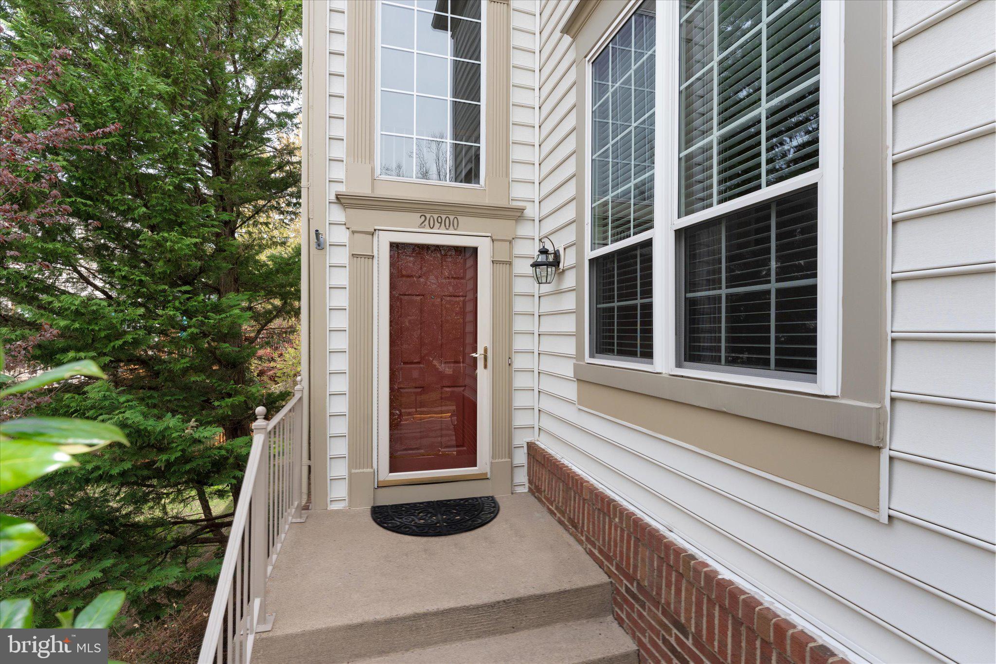 20900 Trinity Square Sterling, VA 20165 - Photo 25 of 46 a view of a house with a door and a window