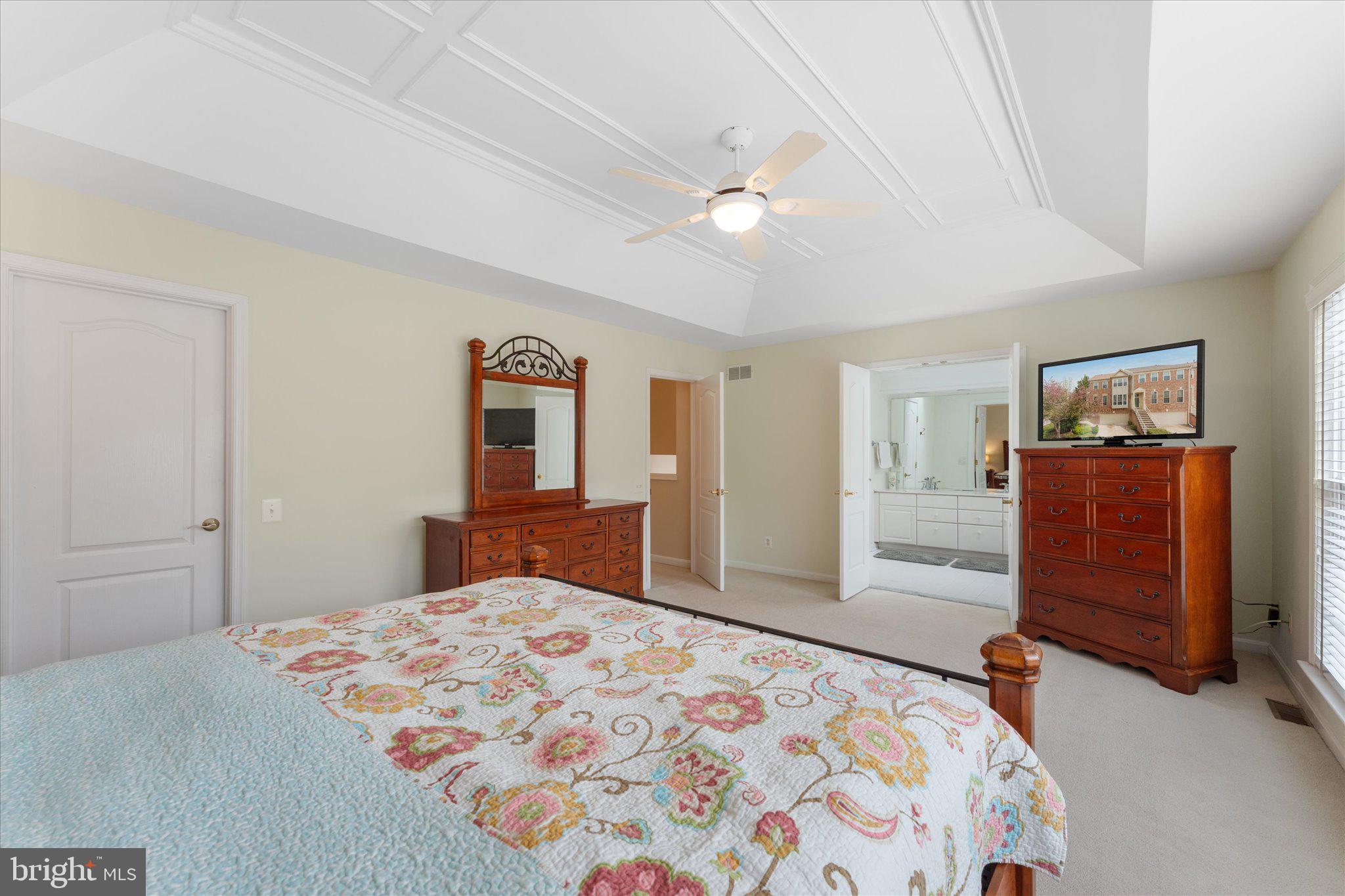 20900 Trinity Square Sterling, VA 20165 - Photo 35 of 46 a bedroom with a large bed and dresser
