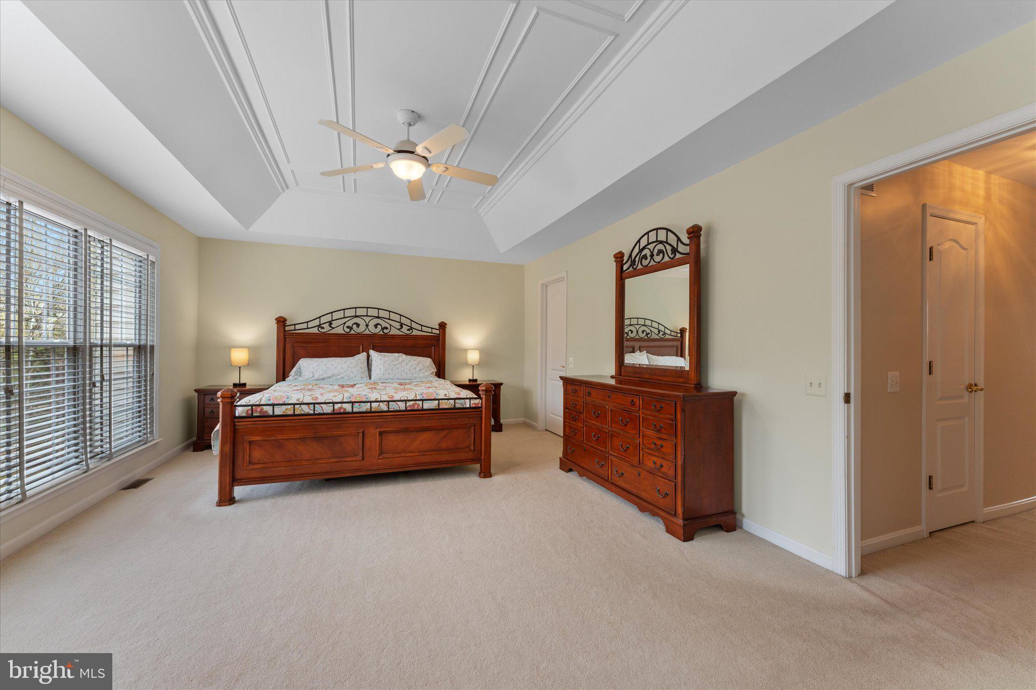 20900 Trinity Square Sterling, VA 20165 - Photo 36 of 46 a spacious bedroom with a bed and wooden floor