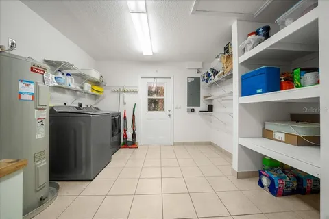 a kitchen with stainless steel appliances granite countertop a refrigerator and a stove