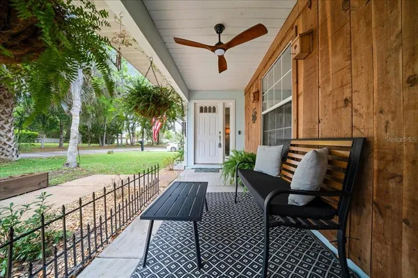 a view of a patio with a table and chairs