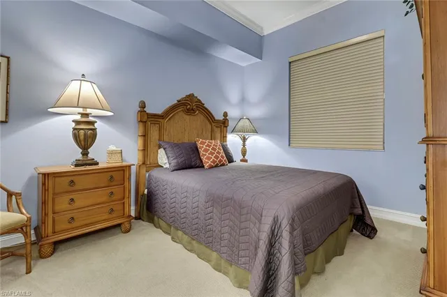 a bedroom with bed and window