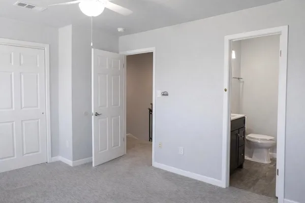 a bathroom view of a toilet and a sink