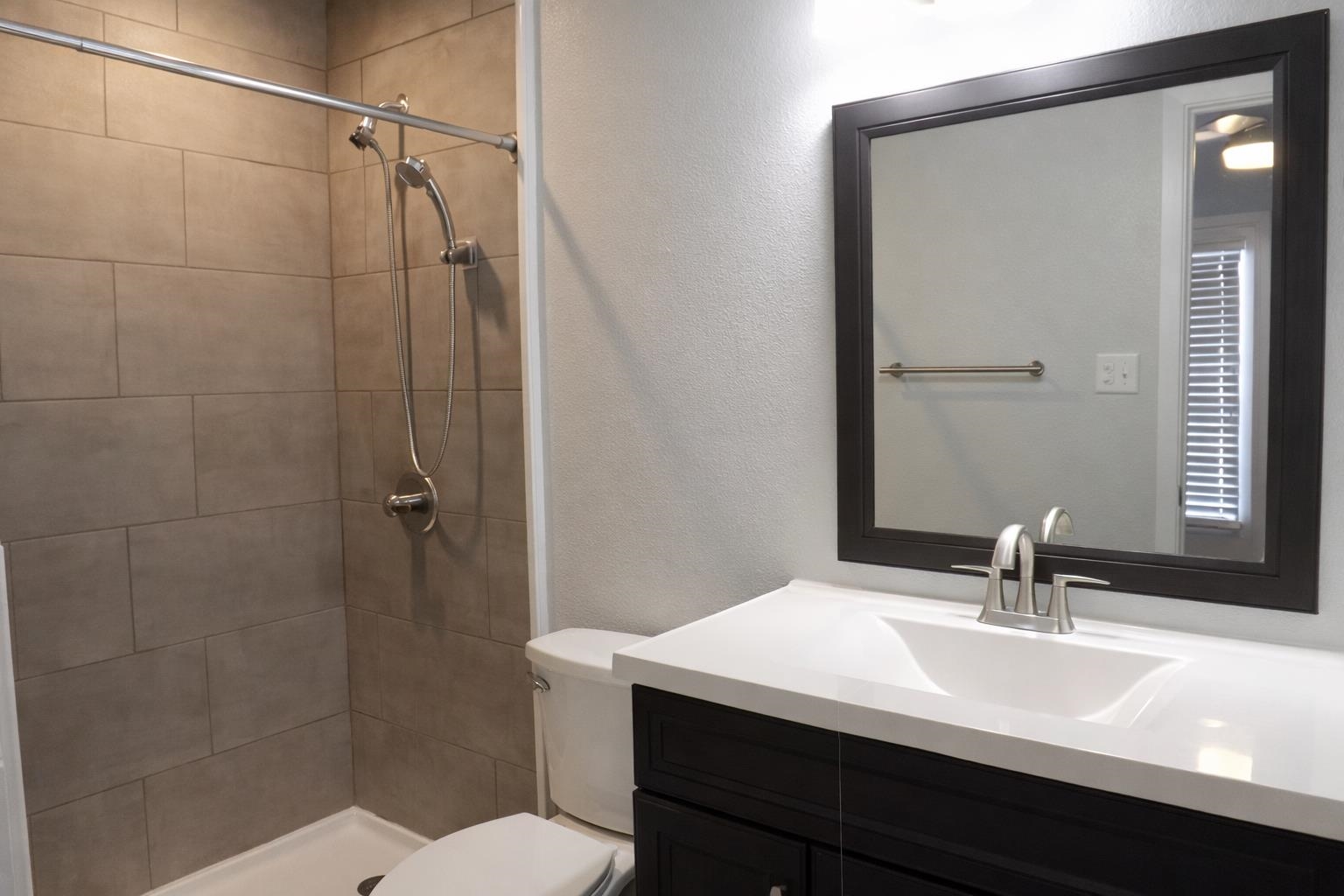 105 Star, Unit 4 Horseshoe Bay, TX 78657 - Photo 7 of 13 a bathroom with a sink a toilet and shower