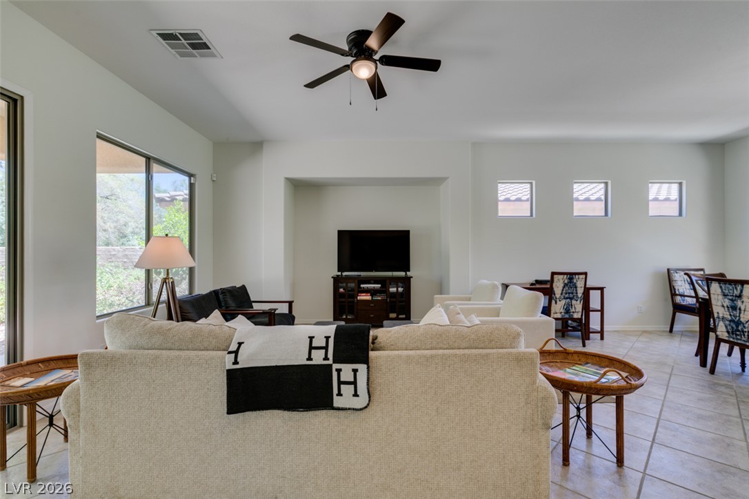 8 Kennesaw Road Henderson, NV 89052 - Photo 15 of 44 A relaxed living space with abundant natural light offers tiled flooring and a convenient ceiling fan.