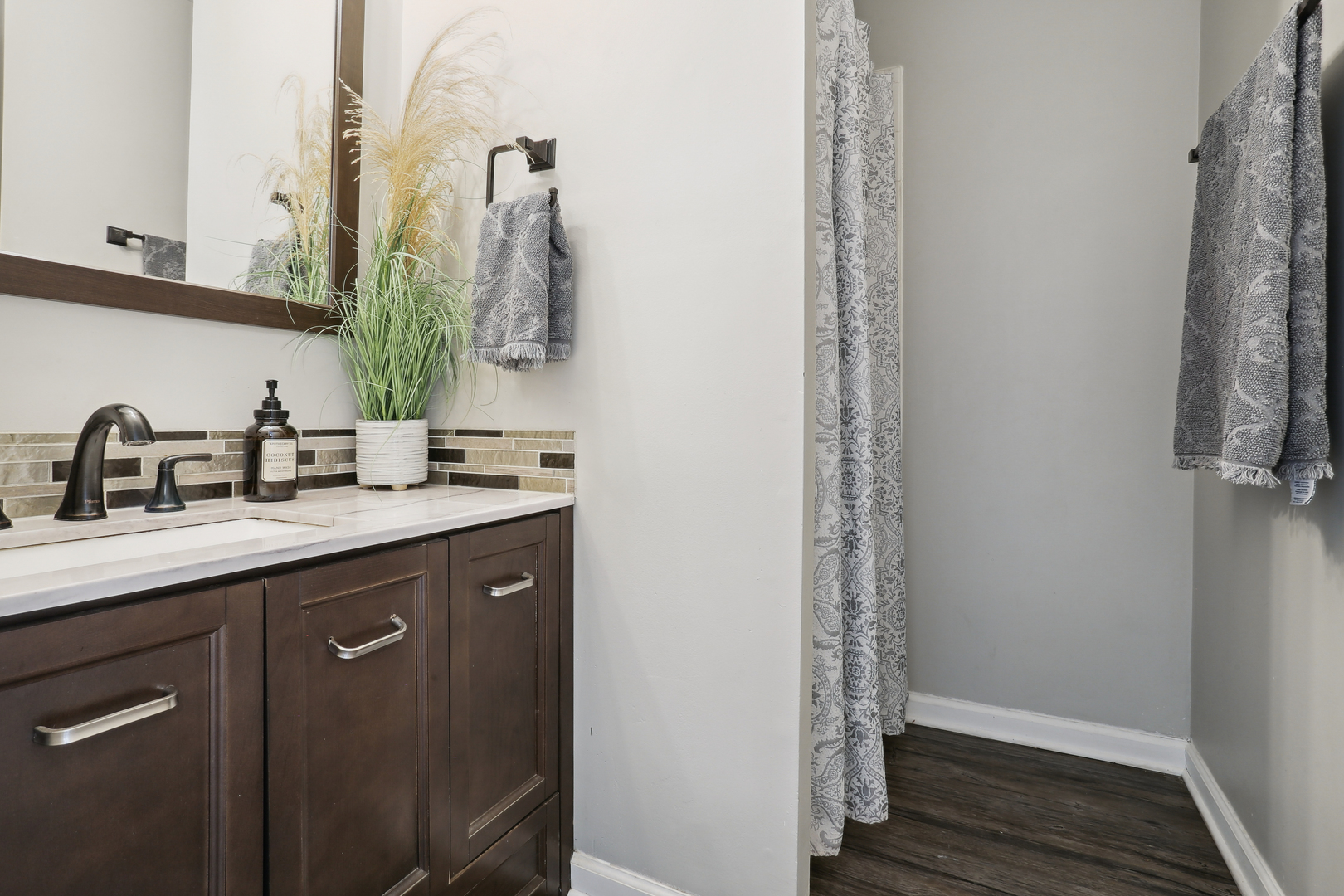 647 Rockhurst Road Bolingbrook, IL 60440 - Photo 11 of 14 a bathroom with a sink and mirror