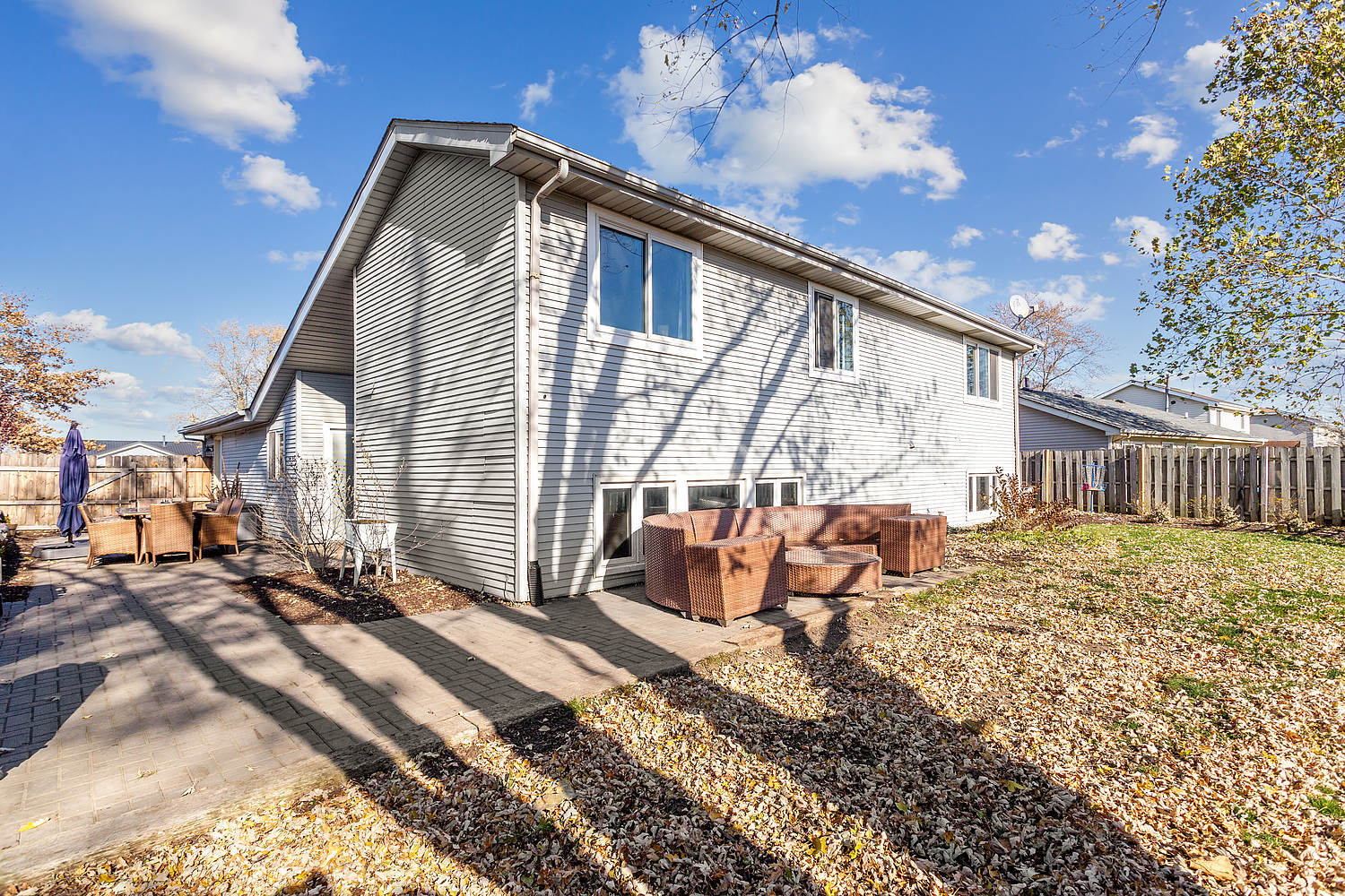 647 Rockhurst Road Bolingbrook, IL 60440 - Photo 14 of 14 a backyard of a house with table and chairs