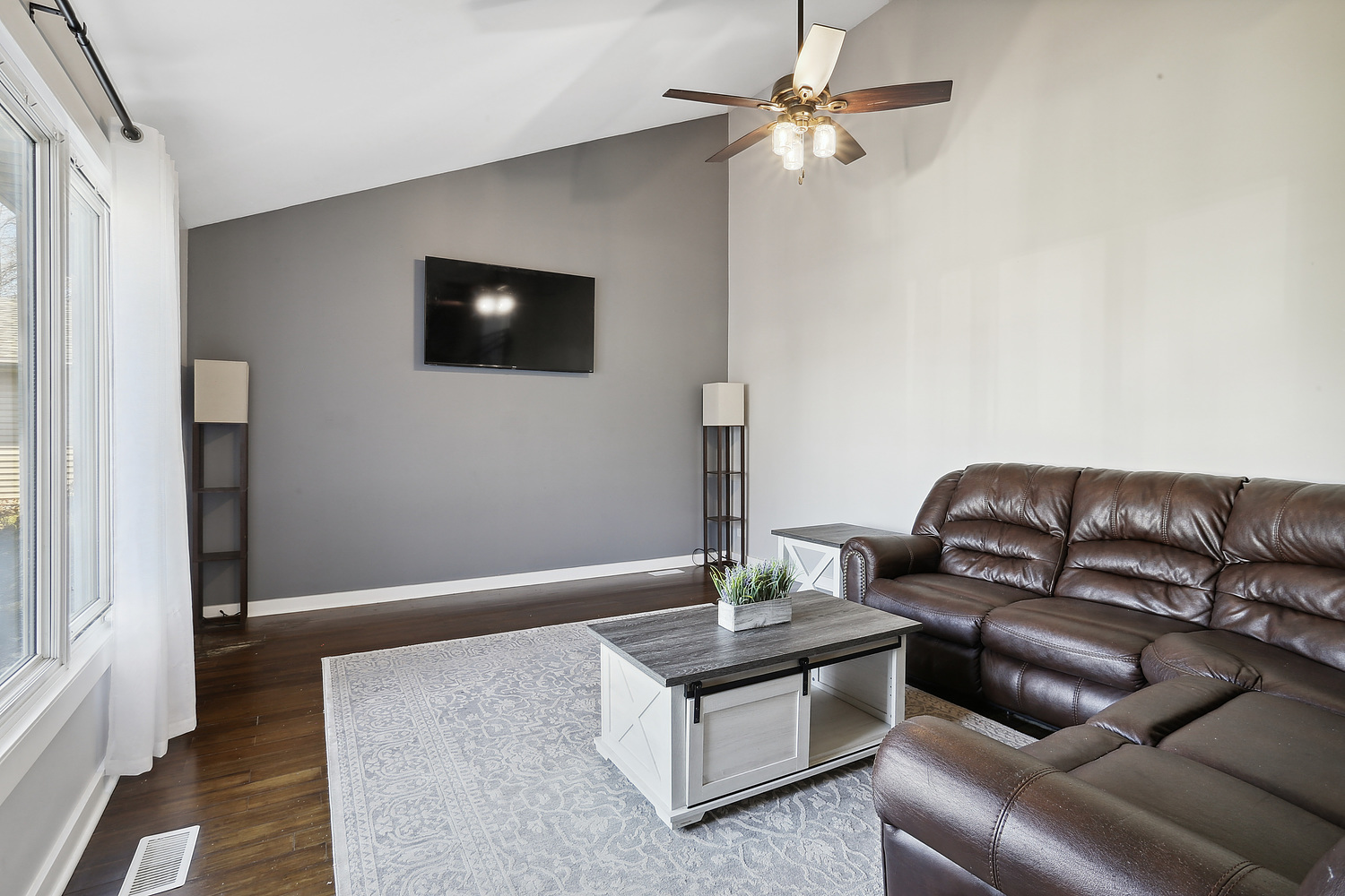 647 Rockhurst Road Bolingbrook, IL 60440 - Photo 3 of 14 a living room with furniture and a flat screen tv